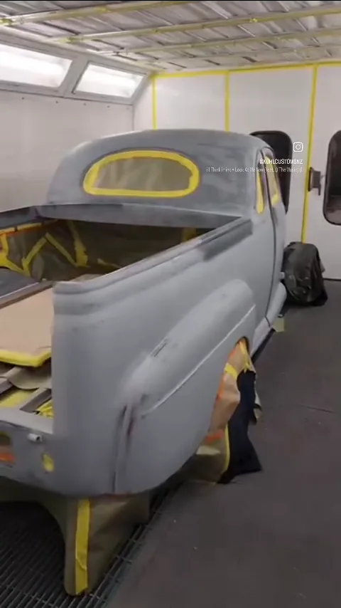 The 1946 Ford ute body in grey primer inside the Kohl Customs spray booth