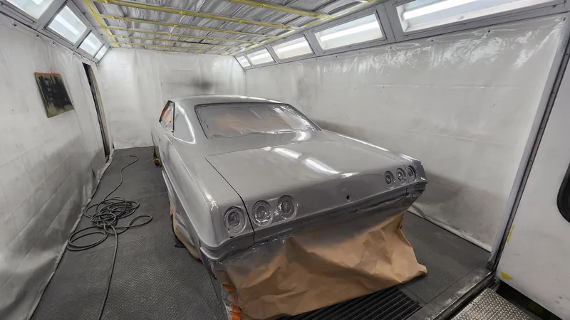 Rear of the Impala inside the spray booth at Kohl Customs, papered off ready to shoot