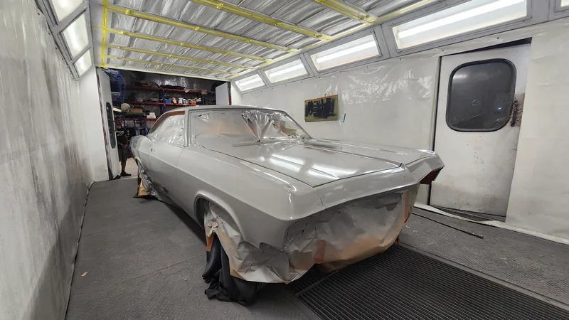 The 1965 Chevrolet Impala masked up in the Kohl Customs spray booth ready for colour