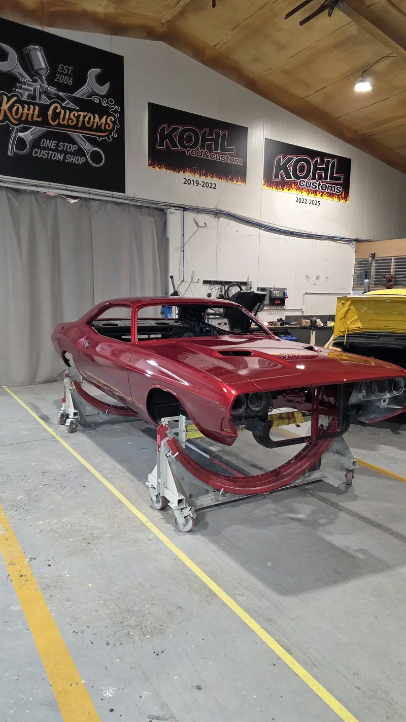 1971 Dodge Challenger in custom metallic red on stands in the Kohl Customs workshop, in final assembly
