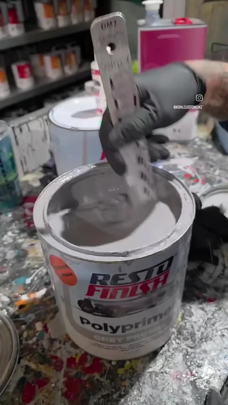 Mixing grey poly primer in the Kohl Customs paint shop before the 1971 Dodge Challenger goes into the booth