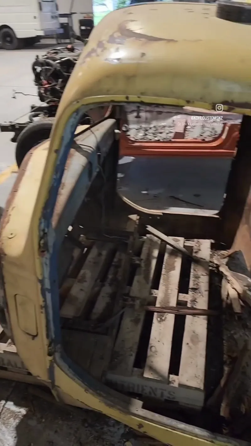 The original Bedford K Series cab in faded cream paint before restoration, rough and stripped of glass