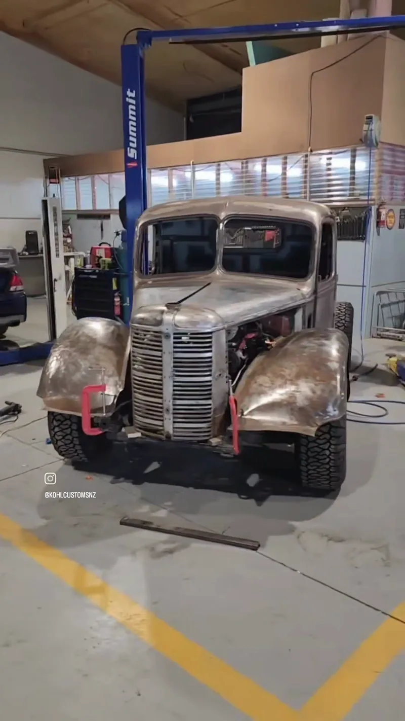 Front view of the Bedford cab on the Colorado chassis in bare metal, grille and front guards fitted