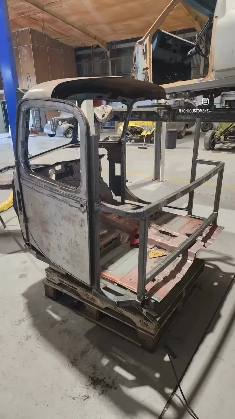 The Bedford cab structure being fabricated in bare steel, showing new framing around the door openings