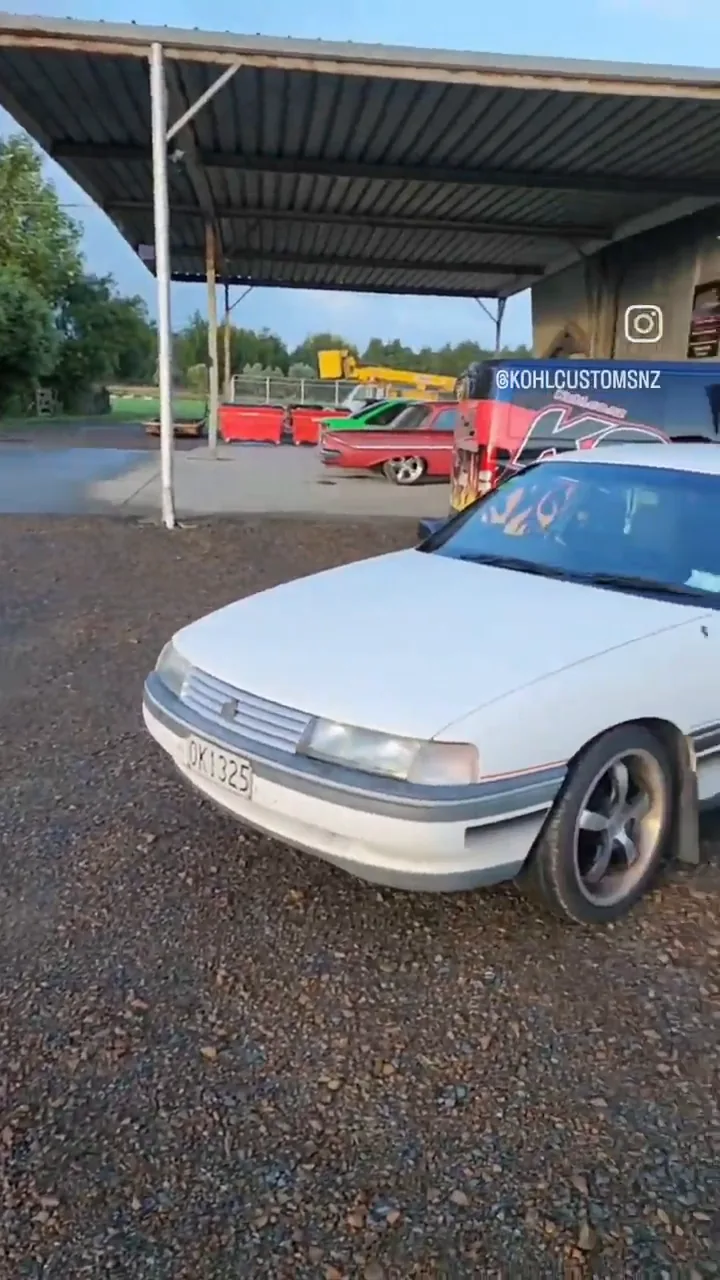 Build montage of Benny's VN Commodore, from arriving in white through to the finished yellow car