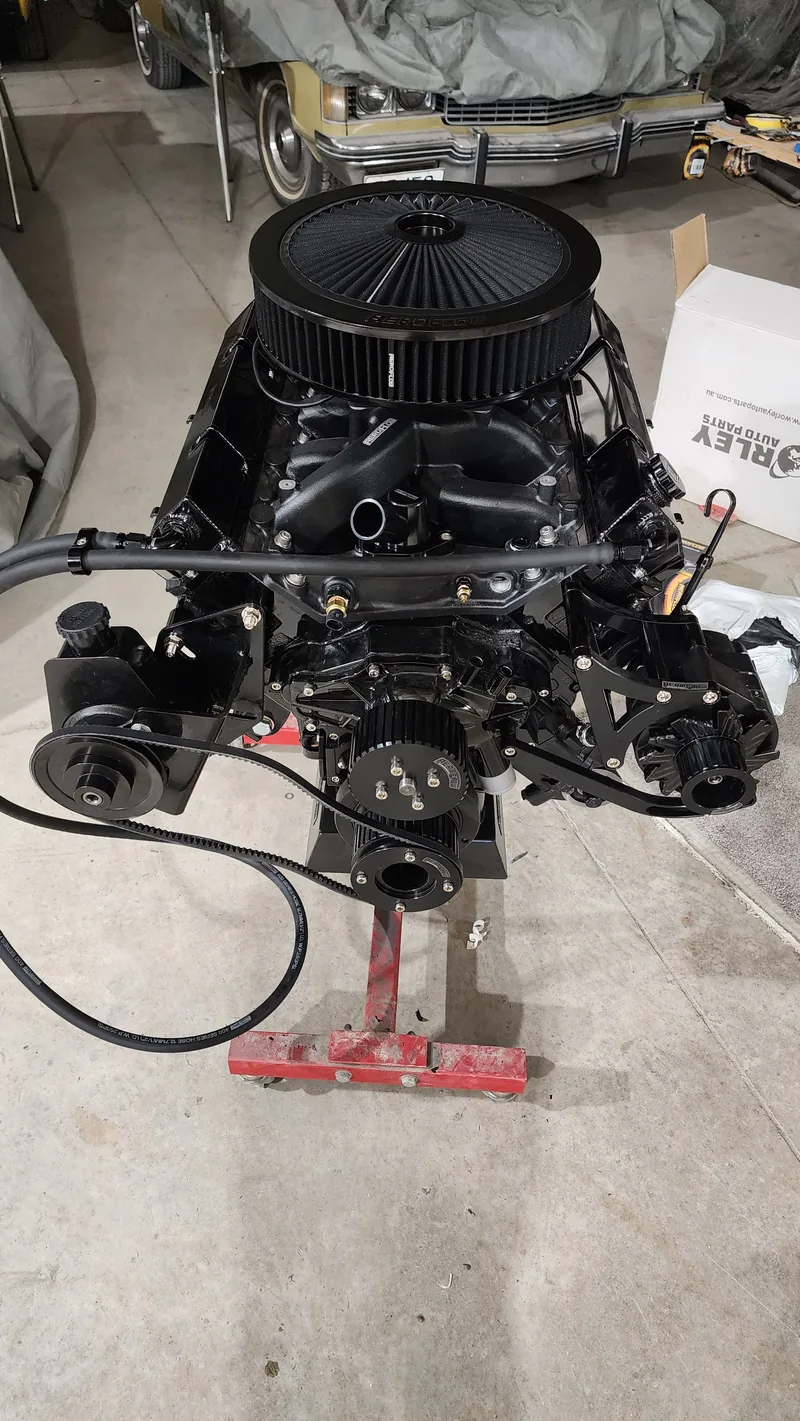 The cammed Holden 304 V8 on the engine stand with Holley Sniper EFI and a large air cleaner fitted