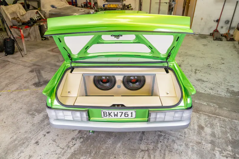 Open boot of the VH Commodore with twin subwoofers set into a trimmed cream rear panel