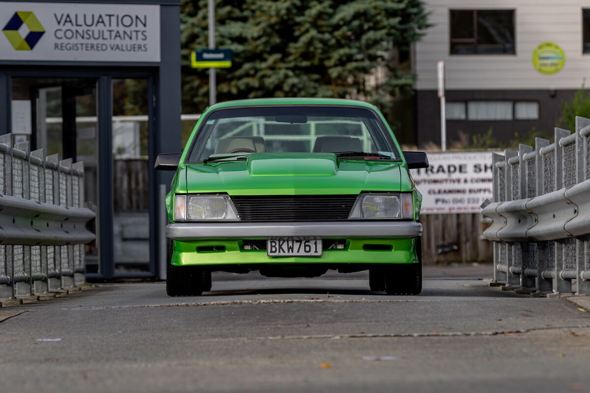 Front view of the completed candy green VH Commodore on the road, registered and road-legal
