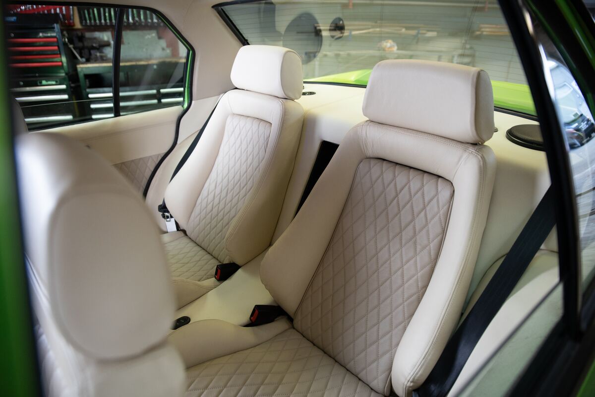 Custom cream diamond-stitch upholstery on the rear seats of the VH Commodore, trimmed in-house at Kohl Customs