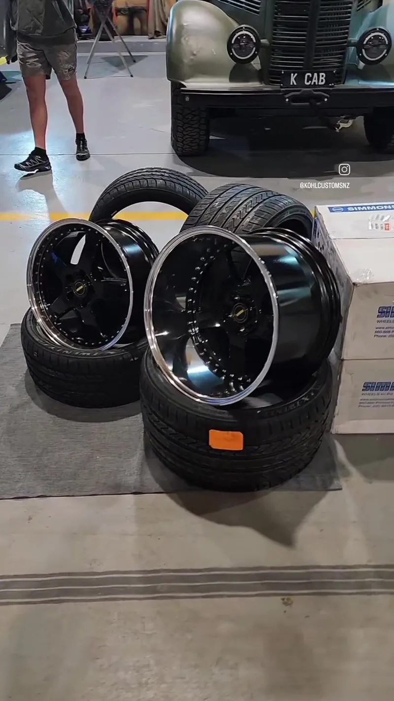 A set of four deep-dish Simmons wheels and tyres waiting at the Kohl Customs workshop